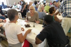 Community members gather over Okra Soup.